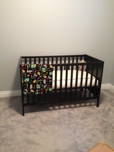 The crib, being the first piece of furniture that was assembled and placed in the room.